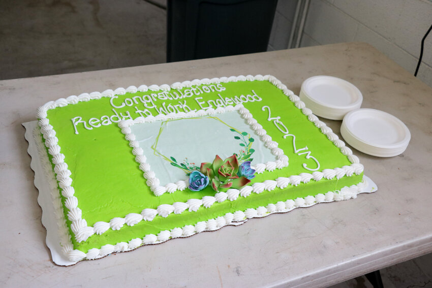 A cake at the groundbreaking event showcases Bridge House's kelly green color.